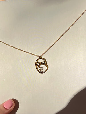 Gold “FACE” necklace